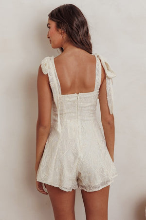 <p>Embroidered Floral Tie Strap Romper</p>