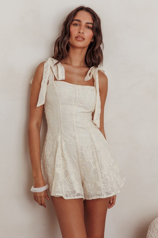 <p>Embroidered Floral Tie Strap Romper</p>