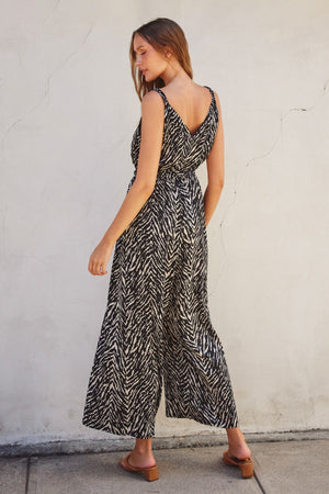 <p>Untamed Cord Strap Surplice Jumpsuit</p>