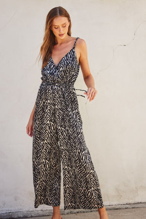 <p>Untamed Cord Strap Surplice Jumpsuit</p>