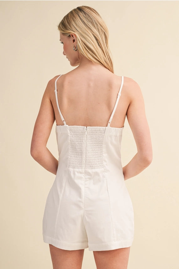 <p>Cotton Sleeveless Romper with Button Details</p>