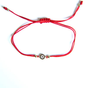 <p>Mini CZ Eye Red Cord Bracelet</p>